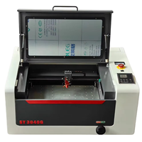 Graveur et graveuse laser CO2 3040 40W refroidi par eau pour métal/caoutchouc avec configuration de table de travail