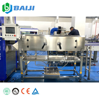 Usine d'embouteillage clé en main compacte avec PLC, écran tactile, conteneur, système RO automatique pour boissons, 2000 BPH, souffleur rotatif de bouteilles 350 ml et table de tri