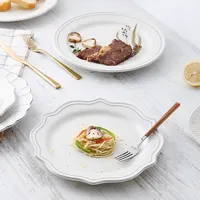 Piatti da pranzo in ceramica goffrata con piatto da dessert bianco alla rinfusa in stile europeo economico personalizzato per matrimonio