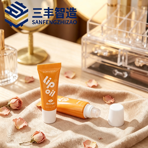 Glossy Orange LDPE Cosmetic Squeeze Tube with Small Roller Ball Applicator & Screw Cap for <b>Lip</b> Oil - Product Image 1