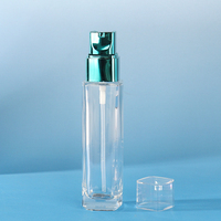 Nouvelle arrivée presse pompe lotion verre sous bouteille 70ml fond épais longue bouteille carrée 2oz vide emballage en verre cosmétique