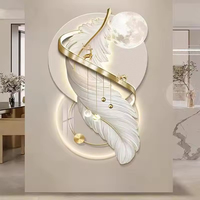 Horloge d'art murale en plumes personnalisée de haute qualité Éclairage LED Décoration murale en céramique de chambre à coucher