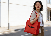 L'usine source vend des sacs à main en tissu tissé personnalisables, écologiques, réutilisables et portables, fabriqués en interne, pour le shopping.