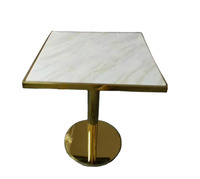 Table à manger carrée de restaurant et bistro, design populaire, base en acier inoxydable doré brillant, plateau en marbre noir