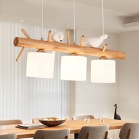 Lustre moderne japonais simple à LED Lampe de salle à manger en bois massif sur le thème des oiseaux pour table à manger à trois têtes à usage domestique
