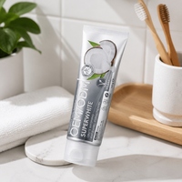 OEM ODM Dentifrice blanchissant super-blanc 97% naturel, saveur noix de coco, végétalien, sans SLES, renforcement de l'émail, 100g