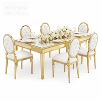 Table de banquet ronde moderne haut de gamme avec plateau en verre trempé et base en acier inoxydable argenté pour la location d'événements hôteliers et extérieurs