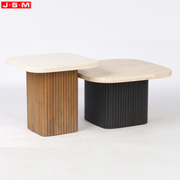 Table basse moderne haut de gamme en pierre naturelle avec base en bois gris clair pour salon