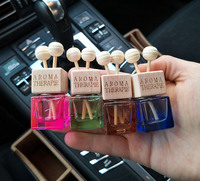 Diffuseur de parfum en verre suspendu de luxe pour voiture, avec couvercle en bois, pour huiles essentielles, vente en gros OEM de haute qualité