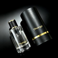 Flacon de parfum rond transparent en verre de 30 ml, 50 ml, 100 ml, avec bouchon en cuir texturé, logo personnalisé, et boîte cylindrique noire – Vente directe usine