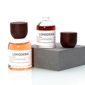 Wholesale Luxury Crimp Glass Perfume <b>Spray</b> <b>Bottle</b> 30ml 50ml 100ml Round <b>Empty</b> Perfume <b>Bottle</b> with Wooden Cap - Product Image 3