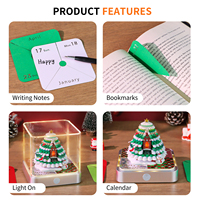 Bloc-notes Maison de Noël 2027 avec base argentée, couche émeraude, porte rouge, lumière tactile, notes sculptées, cube pour décoration de Noël