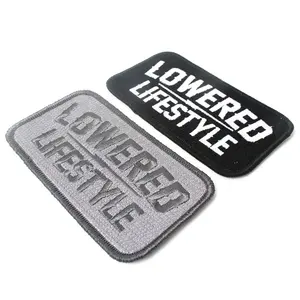 China Embroidered Services Iron on Custom Made Own Name Logo Fabric Merrow Border Embroidery Patches