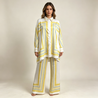 Ensemble deux pièces de luxe pour femme 2026, toucher satiné, imprimé lignes géométriques jaunes, chemise à manches longues et pantalon droit