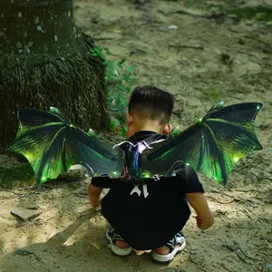 Alas de dragón eléctricas verdes con luces LED y alas de dinosaurio en movimiento con música para niños, niños, niñas, adultos, disfraz de Cosplay