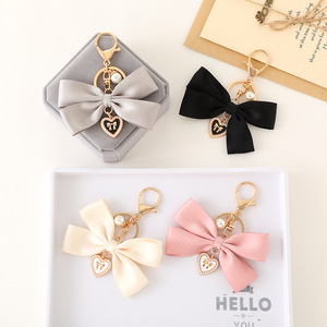 Porte-clés de luxe fait à la main Cheerleading nœud papillon mode perle ruban arc coeur pendentif mignon sac téléphone breloque décoration accessoires - Product Image 1