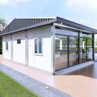 Maison préfabriquée en verre de luxe avec toit incliné, bureau modulaire, studio de jardin moderne pour usage commercial