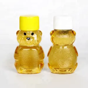 मिनी आकार 2 oz 60 ml पीले पेंच के साथ भालू आकार शहद की बोतलें कंटेनरों में सबसे ऊपर के लिए पुन: प्रयोज्य रस पेय की बोतलें
