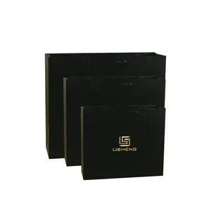 luxury high quality cmyk printed small medium large size A4 gold foil logo matte black paper bag wih ribbon handle sac en papier