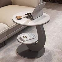 Table basse contemporaine de luxe personnalisable à deux niveaux avec plateau en pierre et structure métallique ronde pour bureau