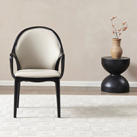 Fauteuil de salle à manger moderne BST en bois noir avec dossier ovale et revêtement en cuir crème pour salle à manger et cuisine