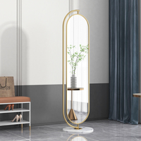 Miroir sur pied ovale à cadre noir mat avec base en marbre, miroir de dressing pour chambre à coucher et salon, vente en gros directe d'usine