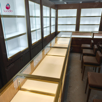 Vitrine murale rétroéclairée Sundo Jewelry Shop, comptoir long en verre, unité de présentation en noyer doré pour magasin de détail