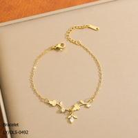 Bracelet tendance en acier inoxydable plaqué or 18 carats hypoallergénique et anti-corrosion avec pendentif fleur en zircon pour femme