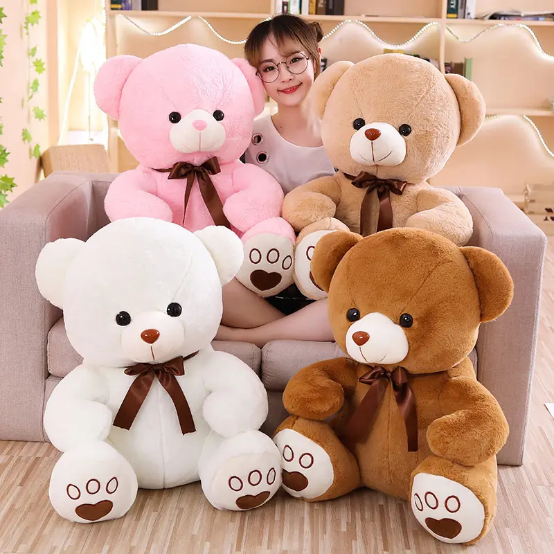 Oreiller en peluche mignon avec arc en peluche jouet griffe Machine poupée cadeau pour enfants en peluche Kawaii