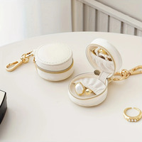 Boîte de rangement pour bijoux en cuir PU mini, très vendue, avec porte-clés, breloques pour sac, organiseur de bijoux de voyage, étui à bijoux rond