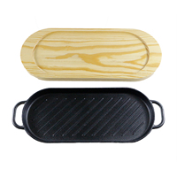 Poêle à griller ovale en fonte pré-assaisonnée durable avec plateau en pin, idéale pour griller et servir