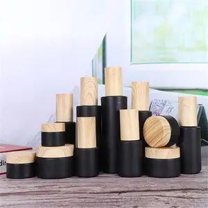 Luxury 30g 50g 100ml Skincare Packaging Set Glass Black Bottle Cosmetic Jar with Plastic Wooden Bamboo Lids