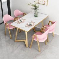 Ensemble de salle à manger avec plateau en ardoise et pieds en métal doré