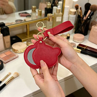 Miroir de poche rotatif et pliable en cuir PU avec logo personnalisé, en forme de cœur ou rond, pour maquillage, idéal pour les voyages et comme cadeau.