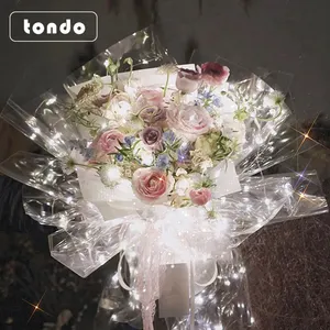 Tondo Stella luminosa Luce bouquet fiore di carta da imballaggio di carta cellophane