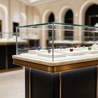 Vitrine de présentation de bijoux en verre personnalisée, comptoir d'exposition en or poli pour magasin
