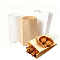 Sac à pain en papier kraft blanc avec logo personnalisé, fenêtre transparente et fermeture à lien métallique, emballage alimentaire en papier pour sandwichs, toasts et pains.