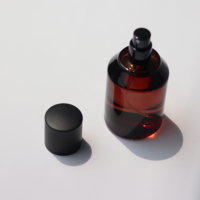 50ml Stock Amber Color Luxury Empty Cylinder Perfume Spray Glass Bottle With Black Cap