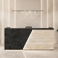Table de réception en marbre naturel pour spa, designs de comptoirs d'accueil en marbre Calacatta noir avec logo