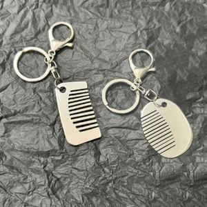 Factory Spot Stainless Steel Combs <b>Personalized</b> Creative <b>Keychains</b> Bags Small Pendants Practical Accessories Niche Designs - Product Image 1