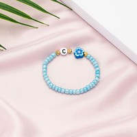 Bracelet personnalisable en perles de riz souples en acrylique plaqué or avec motifs lettres, étoiles et fleurs pour les fêtes d'enfants