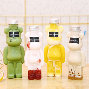 Hot Selling 350ml 400ml 500ml 700ml Pet Plastic Bear Shape Juice Bottle For Drinking With Cap And Straps