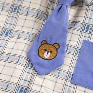 Nuevo Conjunto Deportivo Premium para Niños con Camisa de Solapa y Corbata y Pantalones Cortos de Color Sólido de Proveedor Chino - Product Image 4