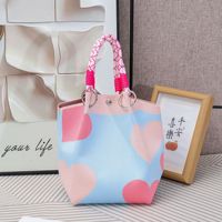 Koreanische neue gestrickte Tragetasche für Damen, große Kapazität, geometrischer Herz-Print, tragbare Handtasche für den täglichen Einkauf