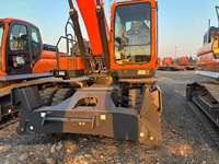 Mesin Pengolah Tanah Efisiensi Tinggi Kapasitas Bucket 0.86m³ Daya Terukur 127kW Excavator Roda DX210W untuk Teknik Kehargaan Kota