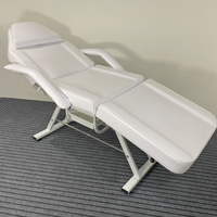 Chaise de massage de beauté luxueuse avec cadre en acier inoxydable noir et blanc, pieds réglables, pliable, lit de tatouage, lit de barbier, thérapie faciale, hôtel