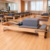 Machine de Pilates Reformer en bois professionnelle pour exercices corporels, idéale pour les salles de sport commerciales, les studios et la remise en forme à domicile
