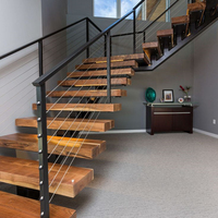 Escalier flottant en acier et bois avec garde-corps en verre pour escalier intérieur moderne invisible à monopoutre