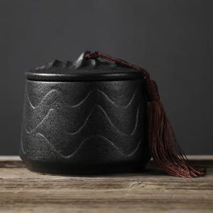 Mountain Shape Lid Matte Ceramic Tea Canister with Embossed Wave Pattern and Tassel Decor Airtight Zen Style Storage Jar - Product Image 1