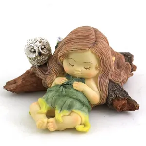 Resin cute girl and owl lying on tree stump garden statue